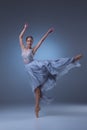 The beautiful ballerina dancing in blue long dress Royalty Free Stock Photo