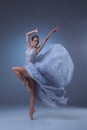 The beautiful ballerina dancing in blue long dress Royalty Free Stock Photo