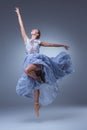 The beautiful ballerina dancing in blue long dress Royalty Free Stock Photo