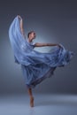 The beautiful ballerina dancing in blue long dress Royalty Free Stock Photo