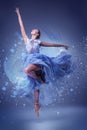 The beautiful ballerina dancing in blue long dress Royalty Free Stock Photo