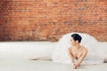 Beautiful ballerina doing the splits while lying on the floor Royalty Free Stock Photo