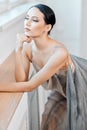 Beautiful ballerina in stage grey loose long transparent dress portrait Royalty Free Stock Photo