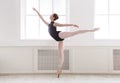 Beautiful ballerina stands in ballet arabesque Royalty Free Stock Photo