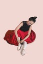 Beautiful ballerina ties up her shoes on the studio Royalty Free Stock Photo