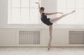 Beautiful ballerine stands in arabesque ballet position Royalty Free Stock Photo