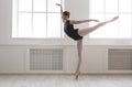 Beautiful ballerine stands in arabesque ballet position Royalty Free Stock Photo