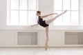 Beautiful ballerine stands in arabesque ballet position Royalty Free Stock Photo