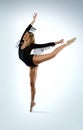 Beautiful ballet dancer doing an arabesque