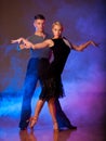 Beautiful ballroom couple preforming their pasonate exhibition d Royalty Free Stock Photo