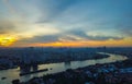 Beautiful Bangkok Cityscape with Chao Phraya River Sunset in the sky with sky blue and orange light of the sun through the clouds