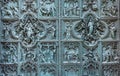 Beautiful bas-reliefs on the bronze door of  building of the Milan Cathedral Duomo di Milano, the cathedral church of Milan, Royalty Free Stock Photo