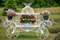 Beautiful Baskets of flowers Hanging Off White Chariot, Red Barn Royalty Free Stock Photo