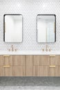 A bathroom with a good cabinet, gold faucet, and tile backsplash.