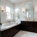 Beautiful bathroom in luxury home with double vanity bathtub and shower Features herringbone tile on floor and marble tile on