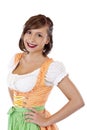 Beautiful, Bavarian woman in Dirndl smiles happy