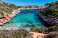 A beautiful bay with clear blue water and a lot of swimmers on mallorca, spain