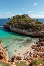 A beautiful bay with clear blue water and a lot of swimmers on mallorca, spain