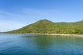 Beautiful bay with coconut palm trees and boats. Tropical sand beach and sea water on island Koh Phangan, Thailand Royalty Free Stock Photo