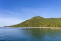 Beautiful bay with coconut palm trees and boats. Tropical sand beach and sea water on island Koh Phangan, Thailand Royalty Free Stock Photo