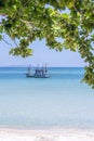 Beautiful bay with fisherman boat on the blue sky background. Tropical sand beach and sea water on the island Koh Phangan, Royalty Free Stock Photo