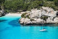 Beautiful bay in Mediterranean sea with sailing boat, Menorca island, Spain. Royalty Free Stock Photo