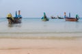 Beautiful beach against seaview with fishing boats dock at kata beach, Phuket, Thailand Royalty Free Stock Photo