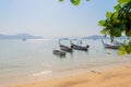 Beautiful beach against seaview with fishing boats dock at kata beach, Phuket, Thailand Royalty Free Stock Photo