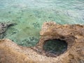Beautiful beach Agios Nikolaos and sea urchins in the Corinthian Gulf of the Ionian sea in Greece on a cloudy autumn day