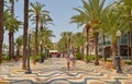 Beautiful beach with black stones and fine white sand in Spain