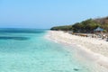 Beautiful beach with blue clean water and cafe Royalty Free Stock Photo