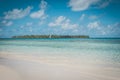 Beautiful beach, blue sky and palm tree island - Royalty Free Stock Photo