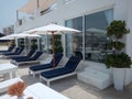 Beautiful beach Cabana with a beautiful white color looks and flowers pots besides.