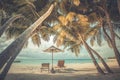 Beautiful beach. Chairs under palm trees sandy beach sea. Summer holiday and vacation concept for tourism. Inspirational beach Royalty Free Stock Photo