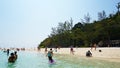 Beautiful beach, clear water and white sand. People relax on the beach. Paradise island.