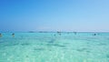 Beautiful beach, clear water and white sand. People relax on the beach. Paradise island.