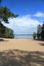 Beautiful beach by the forest lake Royalty Free Stock Photo