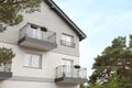 Beautiful beach house with balconies and trees outdoors Royalty Free Stock Photo