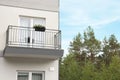 Beautiful beach house with balcony and trees outdoors Royalty Free Stock Photo