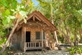 Wooden house near the beach in jungle with palms Royalty Free Stock Photo