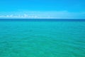 Beautiful beach with palm trees and moody sky. Clouds with blue sky over calm sea beach in tropical Maldives island. Royalty Free Stock Photo