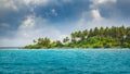 Beautiful beach with palms, storm clouds and sea. Dark clouds approaching a tropical beach Royalty Free Stock Photo