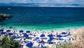 Sea Beach with people on the sand enjoing water and sun