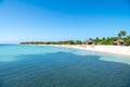 Beautiful beach of Punta Frances, Isla de Juvetud, Cuba. White sand, green palm trees, blue sky and water of Caribbean Island.