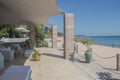 Beautiful beach resort bar at the Indian Ocean, amazing seascape with turquoise colors, palm trees and infinity pool Royalty Free Stock Photo