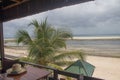 Beautiful beach resort bar at the Indian Ocean, amazing seascape with turquoise colors, palm trees and infinity pool Royalty Free Stock Photo