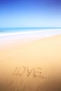 Beautiful beach with sand, blue waves and sky Royalty Free Stock Photo