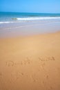 Beautiful beach with sand, blue waves and sky Royalty Free Stock Photo