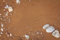 Beautiful beach sand texture with stones. Golden summer beach. Royalty Free Stock Photo