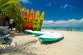 Beautiful beach scenery, kayaks stack on white sandy beach at sunny day Royalty Free Stock Photo